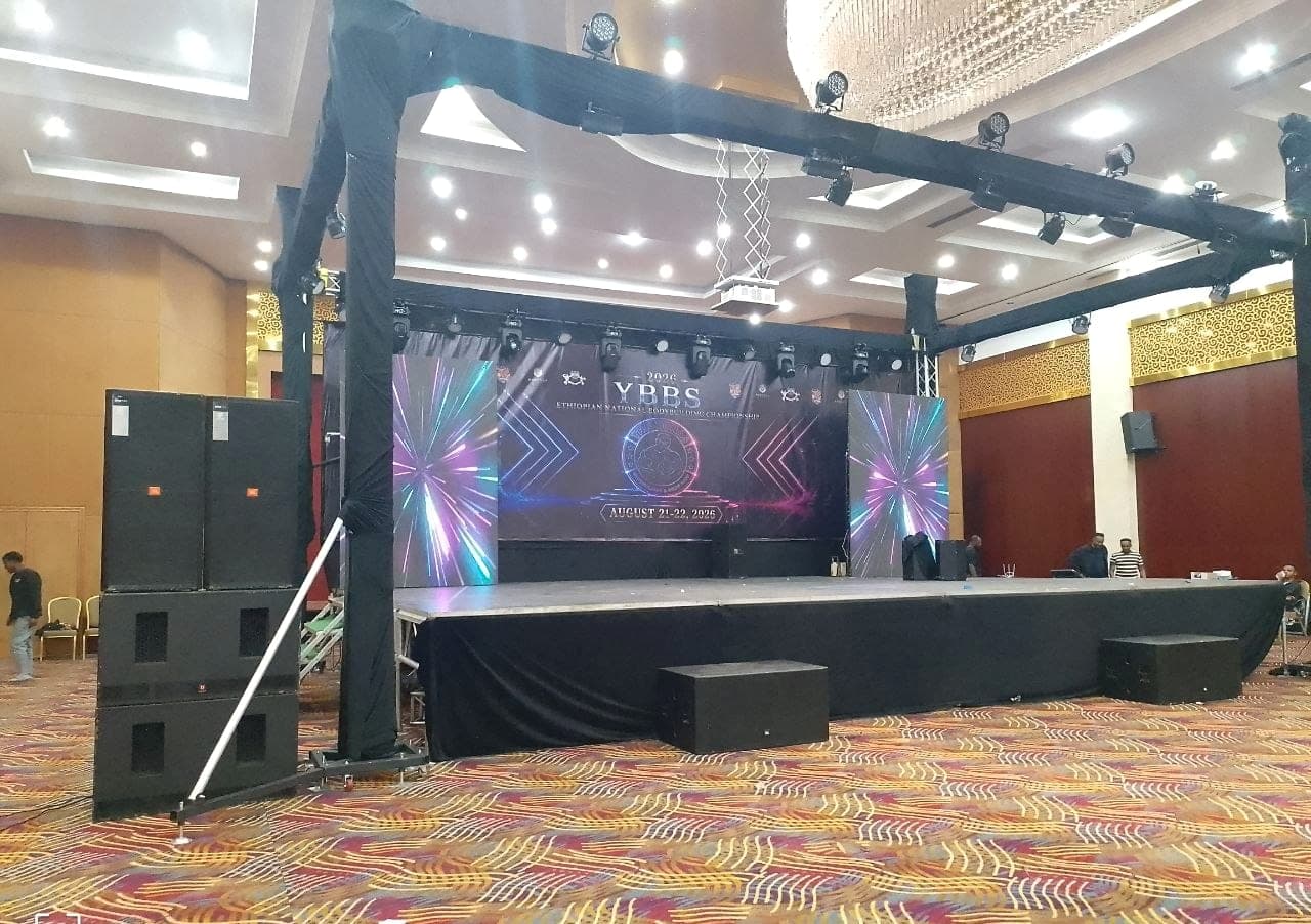 Ballroom stage built for the YBBS Ethiopian National Bodybuilding Championship, with a printed backdrop, LED side panels, truss and stage skirting
